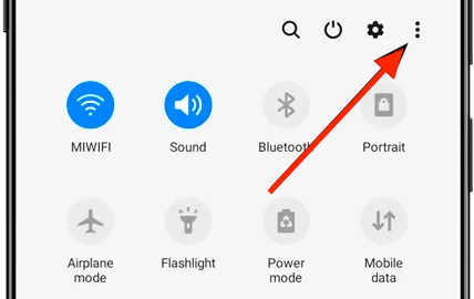 Smartphone settings menu with quick access icons.